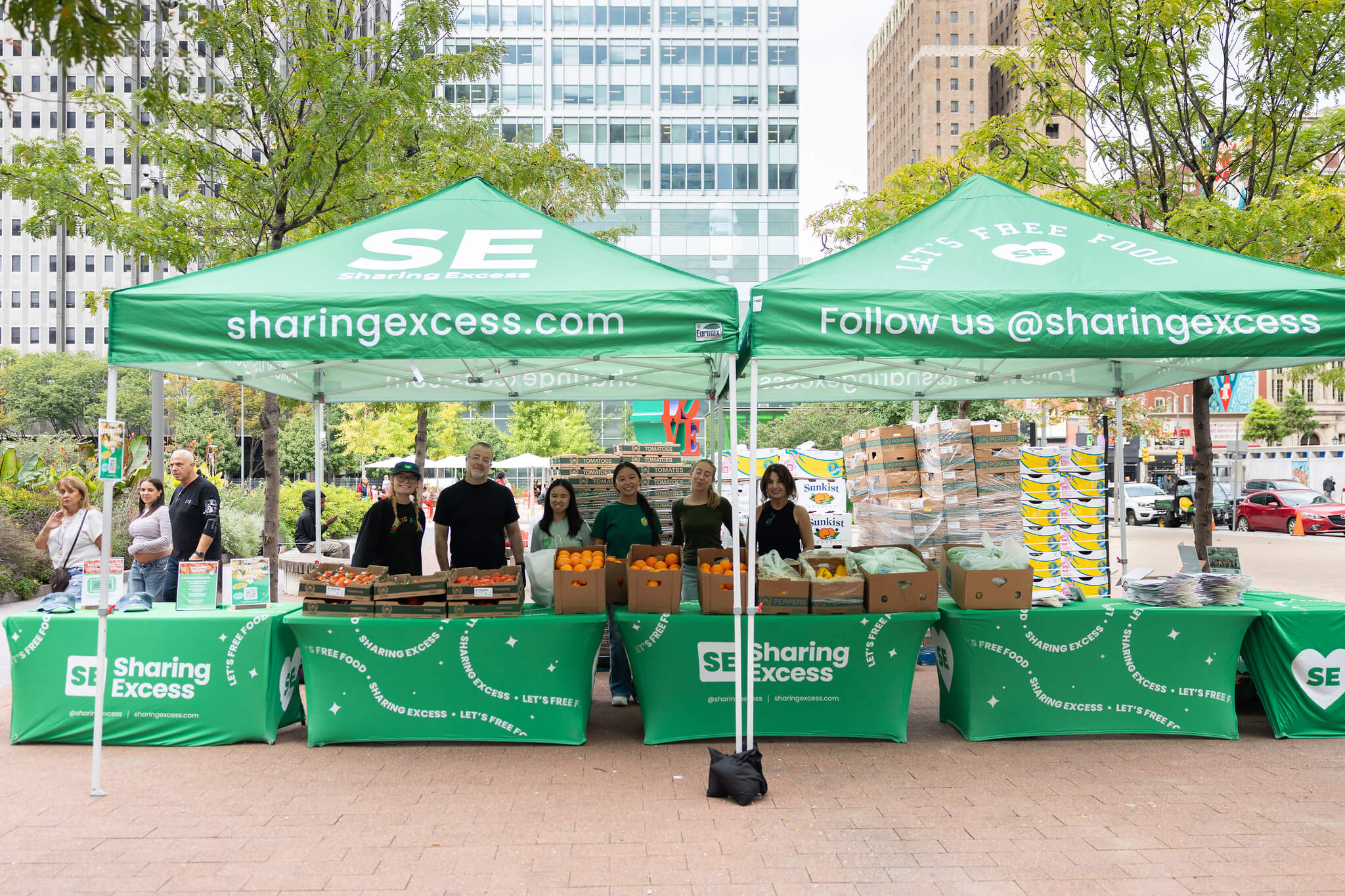 Sharing Excess team members at a produce distribution booth in LOVE Park, Philadelphia